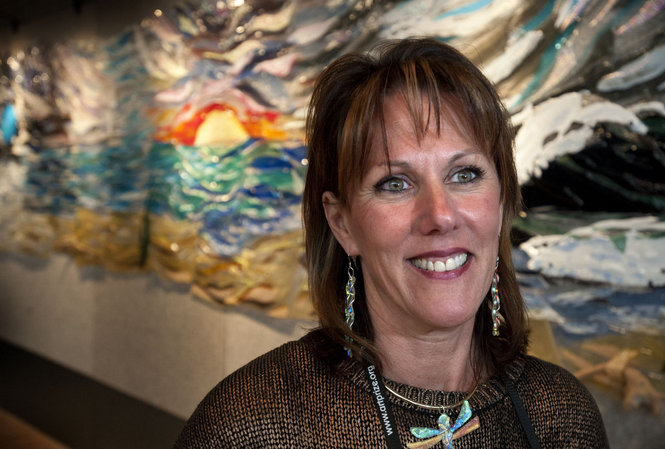 Artist Jilly Barnes is photographed near her top 20 ArtPrize entry "Engulfed in Glass" at the Ford Museum in downtown Grand Rapids, Mich. Sunday, October 5, 2014. (Chris Clark | MLive.com)